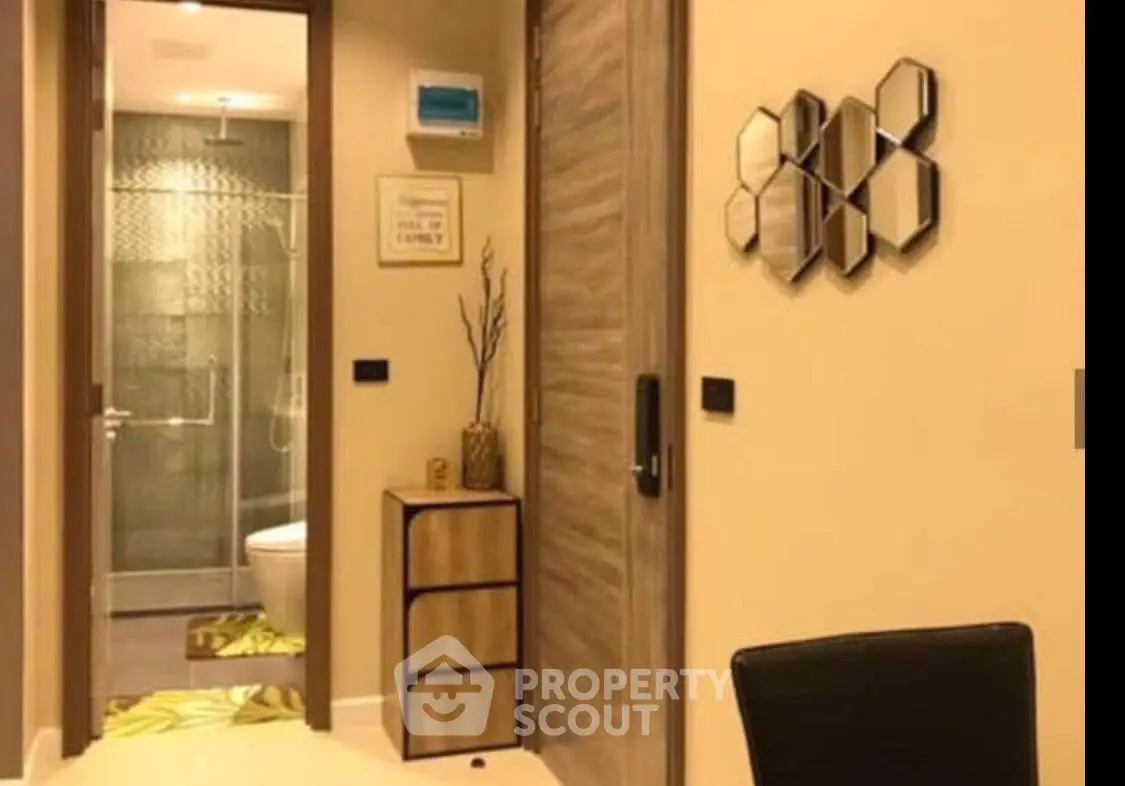 Modern bathroom with stylish decor and sleek fixtures in a contemporary apartment.