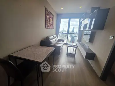 Modern living room with city view, featuring sleek furniture and wall-mounted shelves.