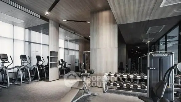 Modern gym with state-of-the-art equipment in luxury residential building.