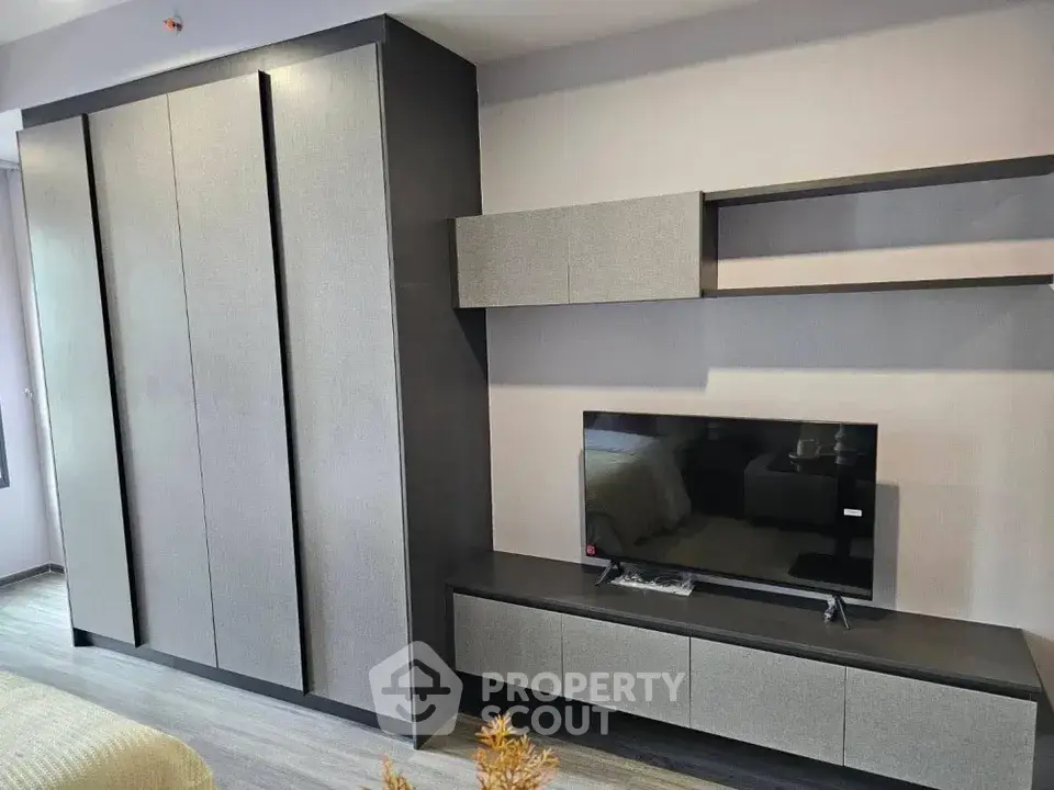 Modern living room with sleek TV unit and stylish storage cabinets