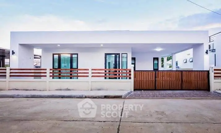 Modern minimalist white house with wooden gate and clean facade