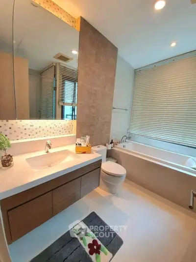 Luxurious modern bathroom with large bathtub and elegant fixtures