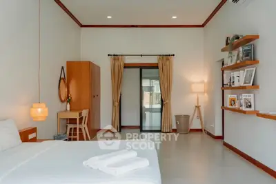Spacious modern bedroom with elegant decor and natural light