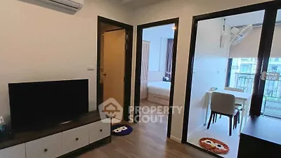 Modern apartment interior with living room, bedroom, and balcony view.