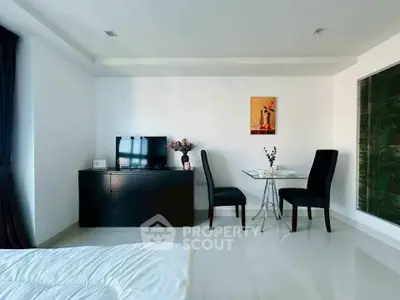 Modern bedroom with sleek furniture and elegant dining area
