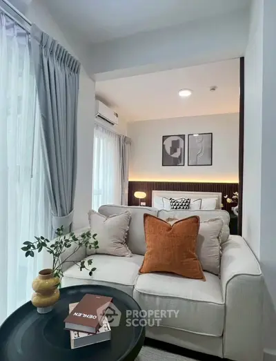 Chic modern living room with cozy sofa and stylish decor, perfect for relaxation and entertaining.