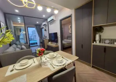 Modern apartment interior with dining area, cozy living room, and stylish decor.