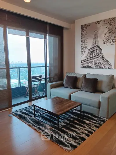Stylish living room with modern decor and balcony view in urban apartment.