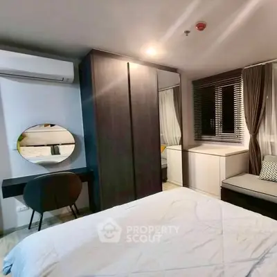 Modern bedroom with stylish decor and ample storage space