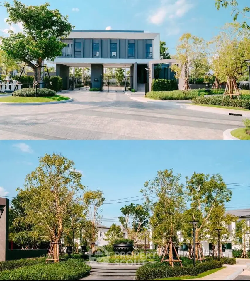 Modern residential building entrance with lush landscaped garden and clear blue sky.