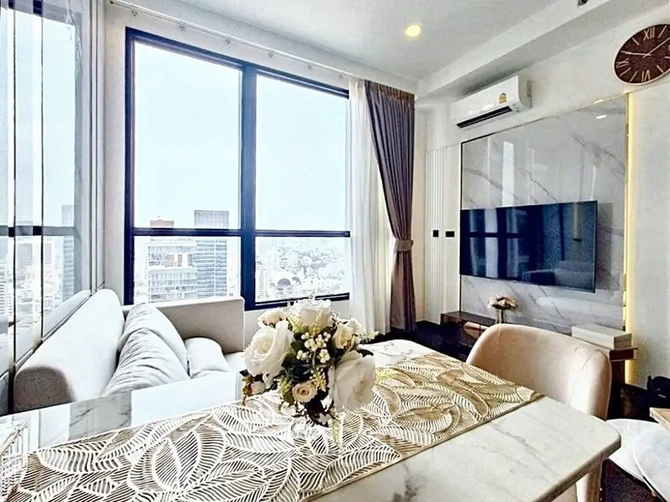 Luxurious modern living room with panoramic city view and elegant decor