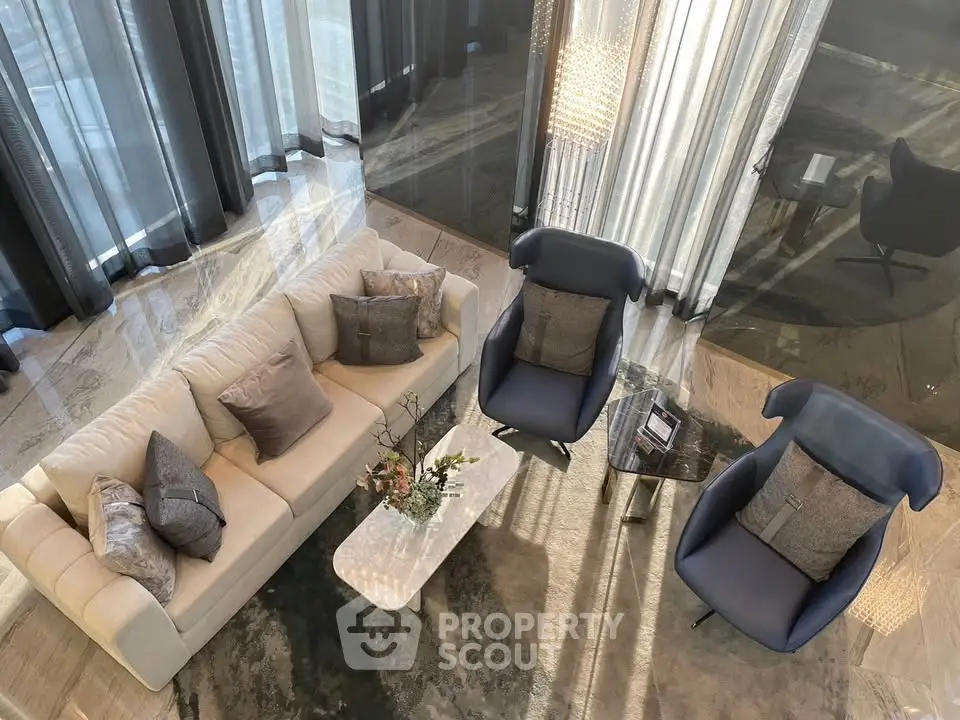 Luxurious modern living room with elegant furniture and floor-to-ceiling windows