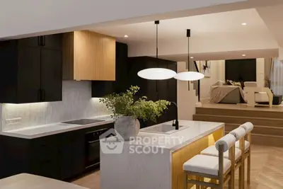 Modern kitchen with sleek design and open layout, featuring a stylish island and elegant lighting.