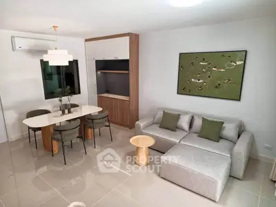 Modern living room with stylish furniture and elegant dining area
