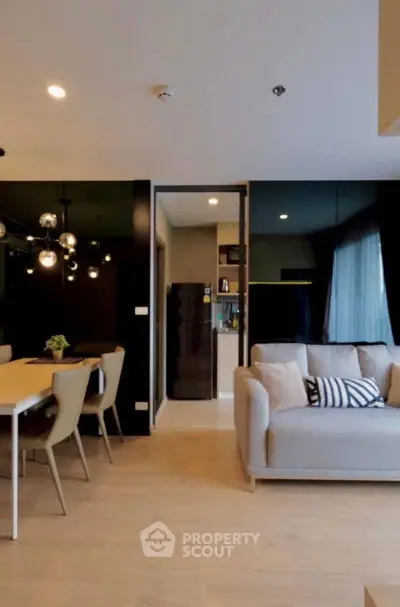 Modern living room with open kitchen and stylish dining area