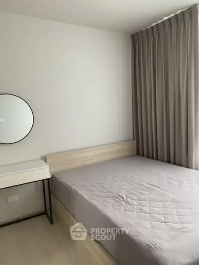 Modern minimalist bedroom with sleek design and natural light