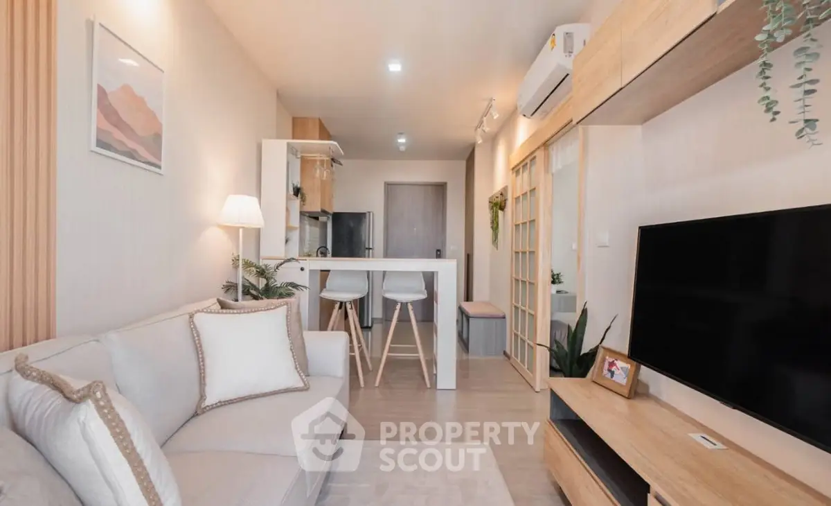 Modern living room with stylish decor and open kitchen layout