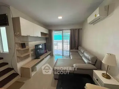 Modern living room with sleek furniture and natural light