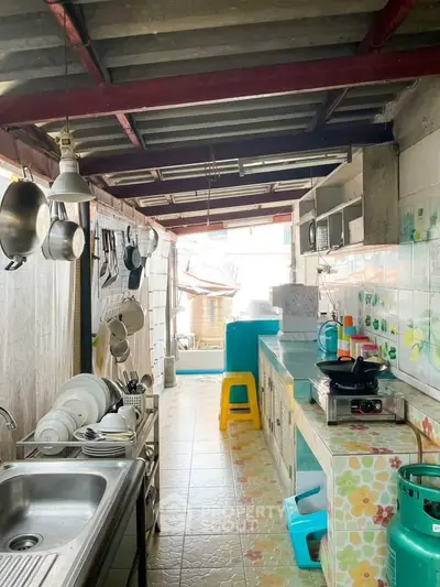 Charming kitchen with open layout and colorful decor, featuring modern appliances and ample natural light.