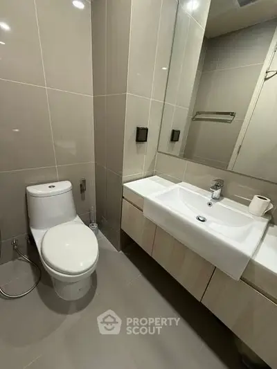 Modern bathroom with sleek fixtures and neutral tones