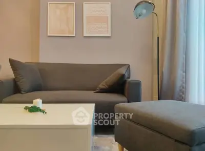 Modern living room with stylish gray sofa and elegant decor