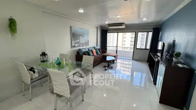 Spacious living room with modern decor and city view balcony