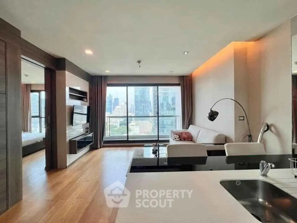 Modern living room with city view, open layout, and stylish decor