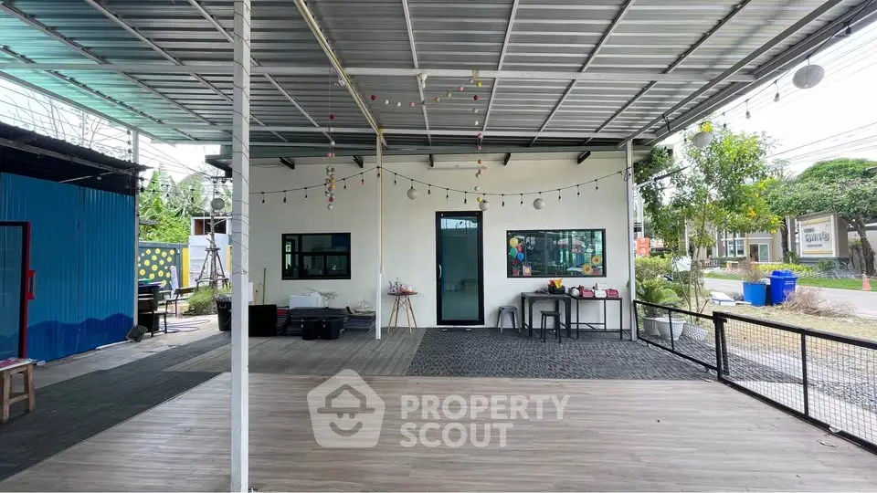 Spacious outdoor area with modern design and festive lighting, perfect for gatherings and events.