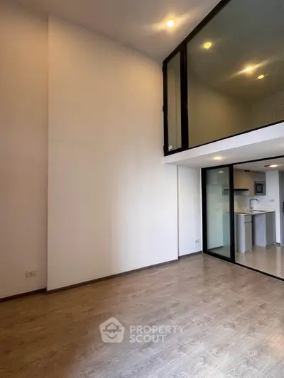 Modern duplex apartment with high ceilings and open kitchen layout