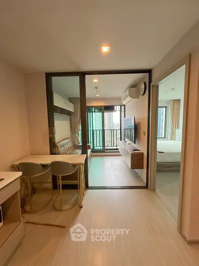 Modern condo interior with open living area and balcony view