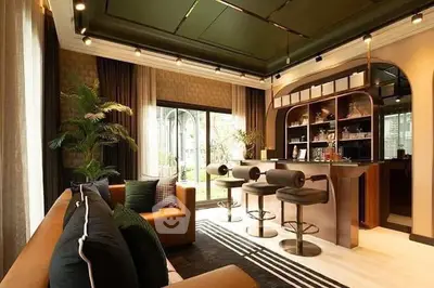 Luxurious living room with stylish bar area and elegant decor