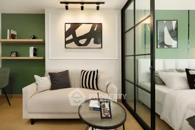 Modern living room with stylish decor and cozy seating area, featuring green accent wall and contemporary artwork.