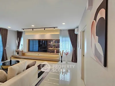Modern living room with stylish decor and large TV unit