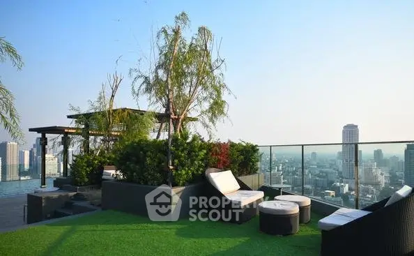 Luxurious rooftop garden with stunning city view and modern seating area.