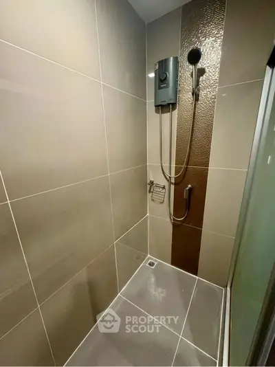 Modern bathroom shower with sleek tiles and high-end fixtures