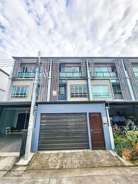Modern townhouse exterior with unique facade design and garage