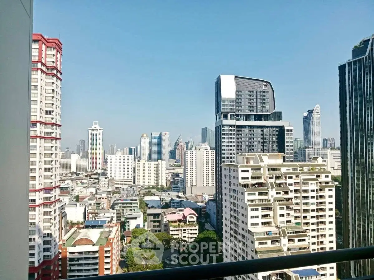Stunning cityscape view from a high-rise balcony showcasing modern urban architecture and skyline.