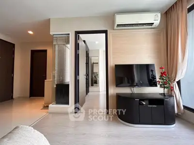 Modern living room with sleek TV unit and air conditioning in stylish apartment