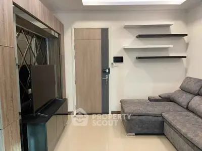 Modern living room with sleek furniture and stylish shelving, perfect for contemporary living.