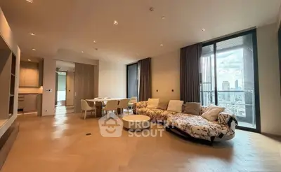 Spacious modern living room with city view and elegant furnishings