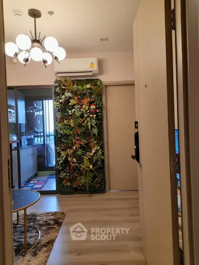 Stylish apartment interior with modern lighting and lush vertical garden wall