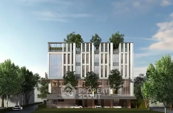 Modern architectural building with sleek design and lush greenery on rooftop.