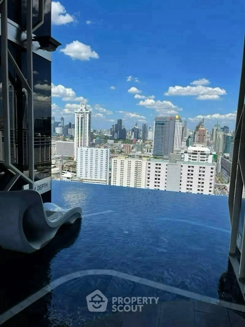 Stunning rooftop infinity pool with breathtaking city skyline view