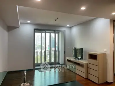 Modern living room with balcony view in urban apartment