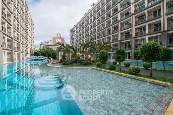 Luxurious apartment complex with stunning pool and lush landscaping
