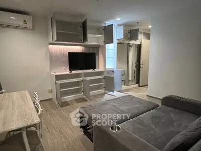 Modern living room with sleek furniture and built-in storage solutions