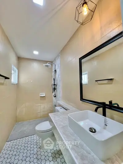 Modern bathroom with stylish fixtures and elegant lighting