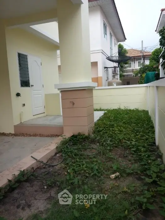 Charming suburban home with lush garden and inviting entrance, perfect for family living.