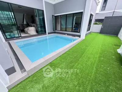 Modern home with private pool and artificial grass lawn