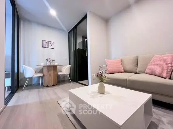 Modern living room with cozy sofa and dining area in stylish apartment